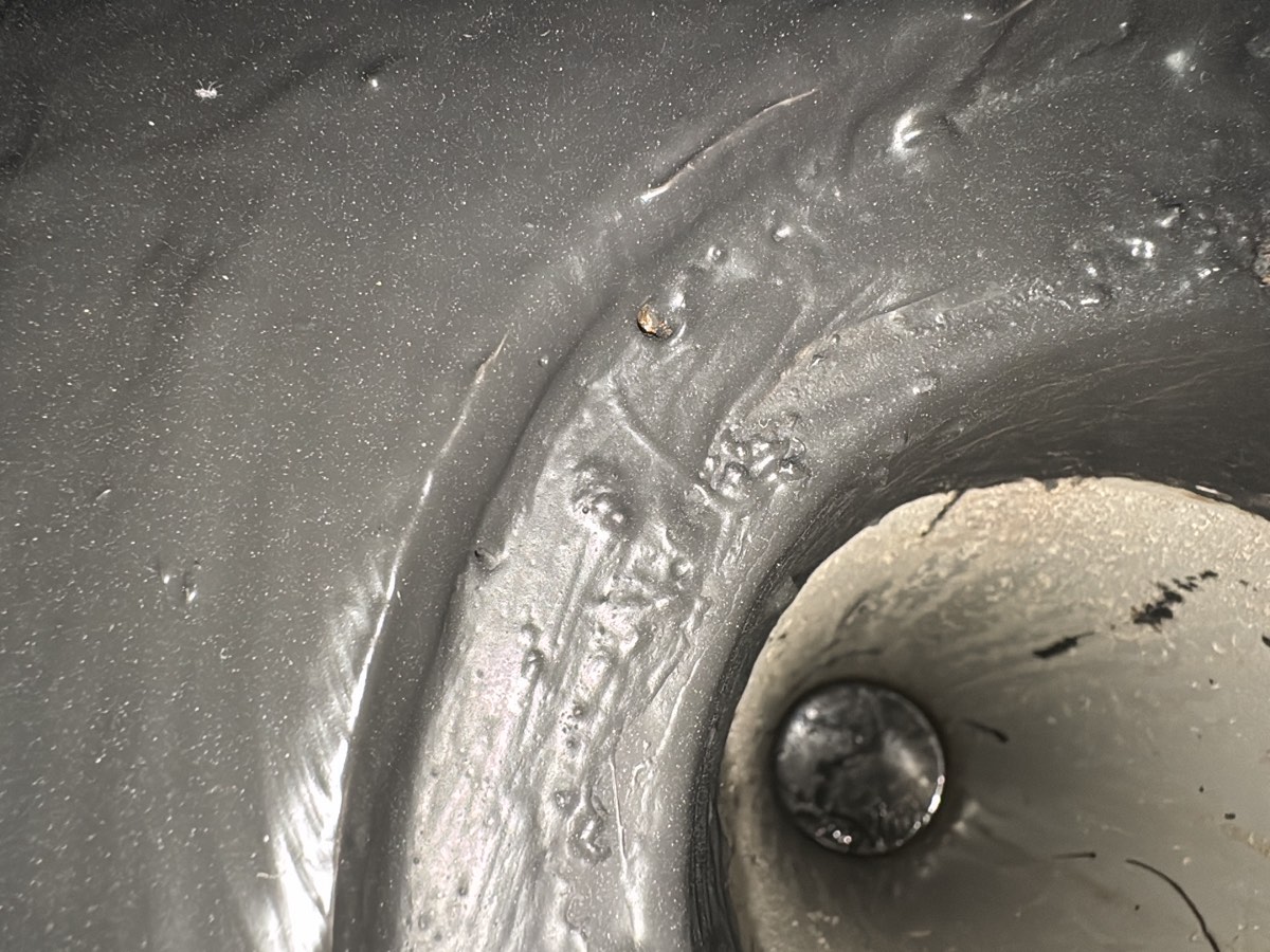 Pinholes to a shower recess, recorded during a fixing stage inspection in Schofields